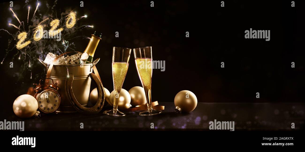 New year celebration banner with text 2020 champagne bottle and glasses, golden christmas decorations and fireworks against a dark background in panor Stock Photo