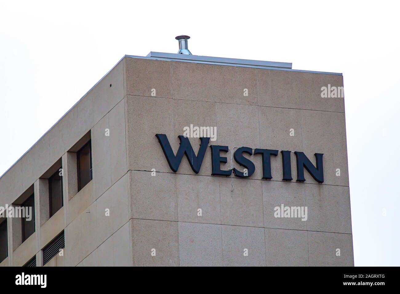 Calgary, Alberta. Canada Dec 20 2019. The Westin hotel top sign from a building. Unionized workers launch walkout at The Westin Hotels. Illustrative Stock Photo