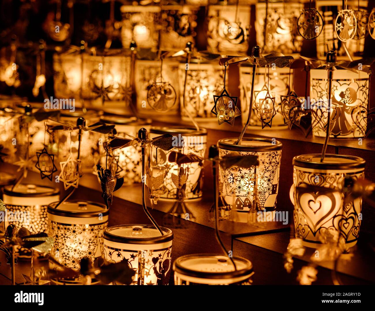 Close up of Golden Christmas candle mobiles at Leicester Square