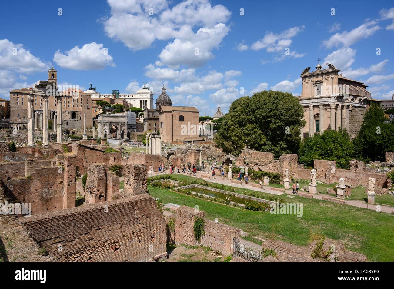 Rome. Italy. Roman Forum (Forum Romanum/Foro Romano), view of the Atrium or Peristylium Vestae of the House of the Vestals (foreground) with the Templ Stock Photo