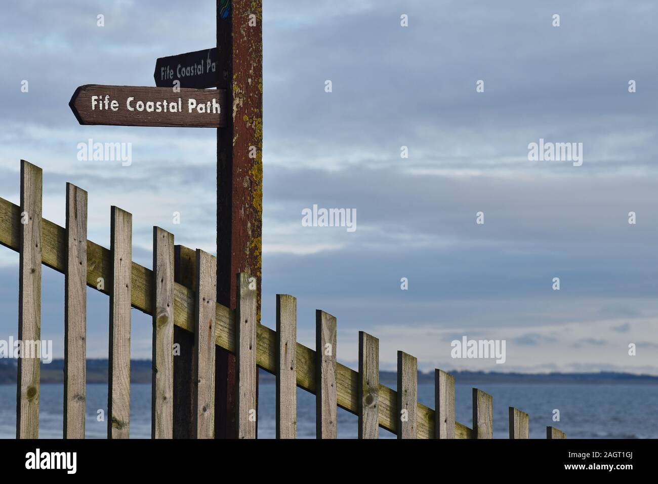 Fife Coastal Path wooden signpost with sea in background taken at Leven