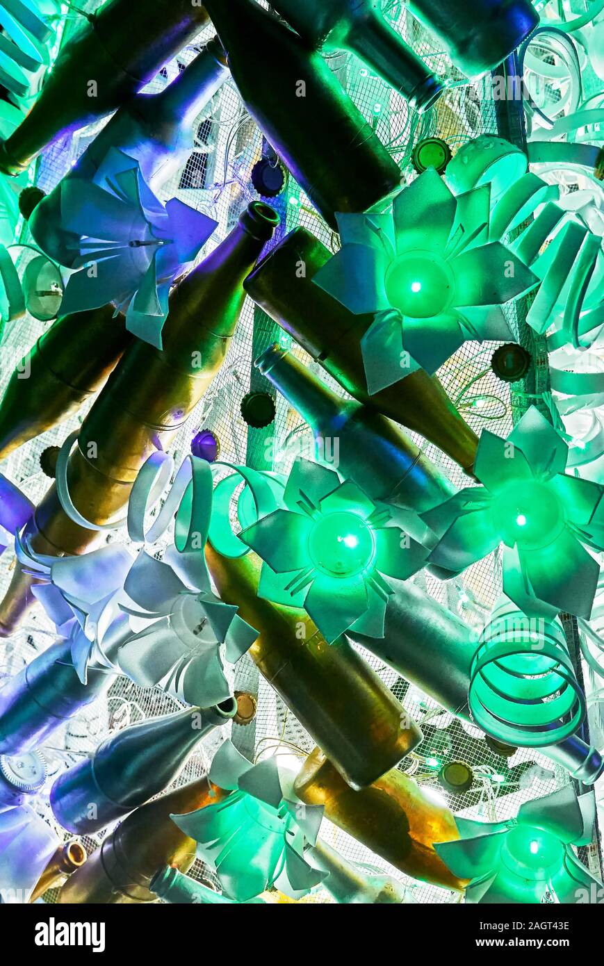 Close-up of a unusual Christmas decoration of recycled plastics and bottles combined with cold flower shaped lights, seen in the Philippines Stock Photo