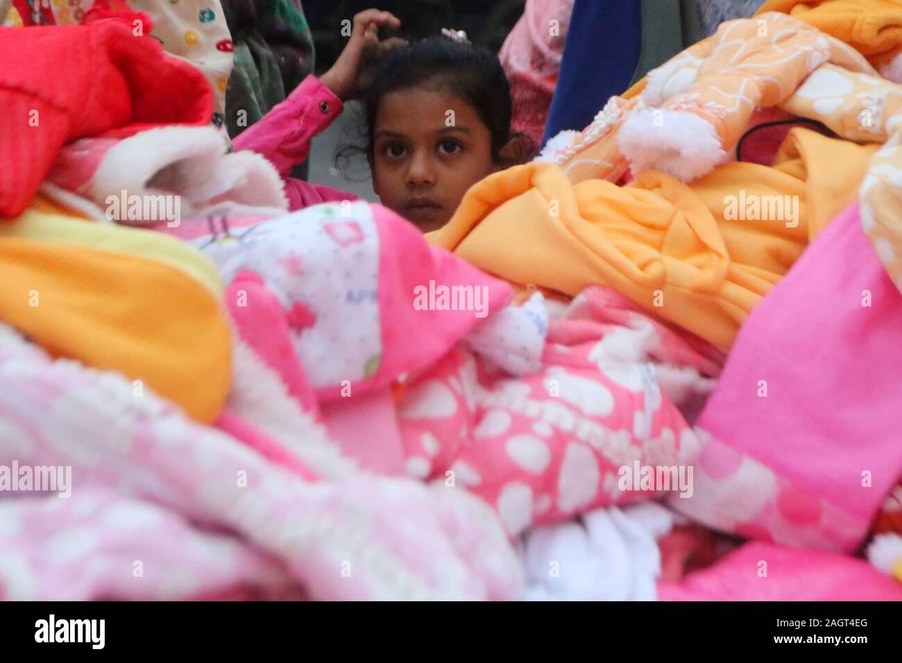 Dhaka, Bangladesh. 21st Dec, 2019. Bangladeshi citizens buy winter clothes during a cold wave in Dhaka.A biting cold spell continues to sweep across northern Bangladesh and a few other parts of the country although mercury readings point to an end to a cold wave. Credit: Sultan Mahmud Mukut/SOPA Images/ZUMA Wire/Alamy Live News Stock Photo