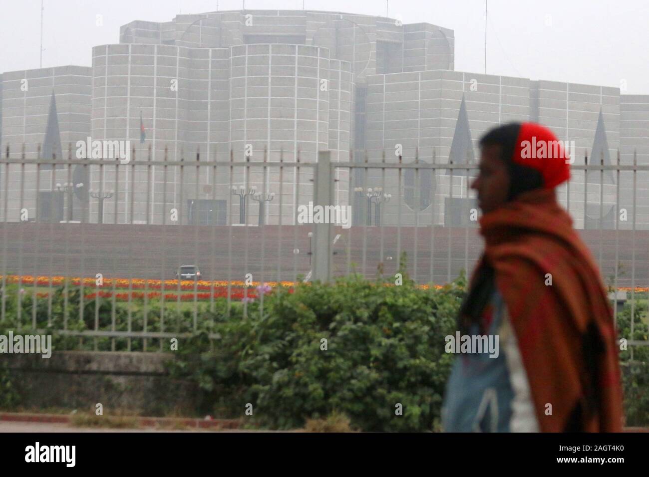 Dhaka, Bangladesh. 22nd Dec, 2019. A view of the Parliament House of Bangladesh with a smoke haze during a cold wave in Dhaka.A biting cold spell continues to sweep across northern Bangladesh and a few other parts of the country although mercury readings point to an end to a cold wave. Credit: Sultan Mahmud Mukut/SOPA Images/ZUMA Wire/Alamy Live News Stock Photo