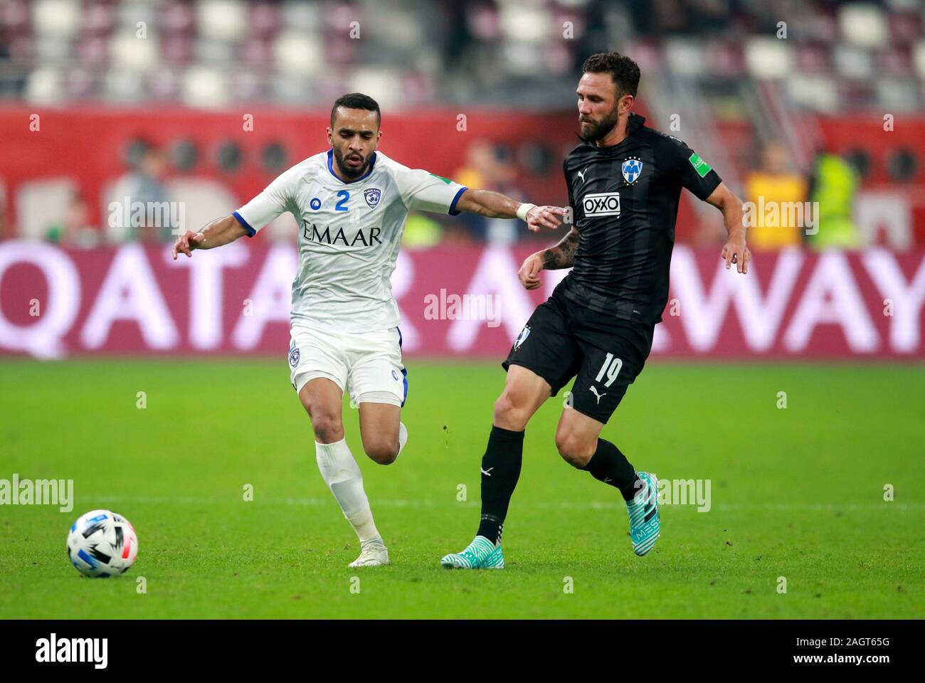 Al Hilal FC's Mohammed Al-Burayk (left) and Monterrey's Miguel Layun battle for the ball during the FIFA Club World Cup third place match at the Khalifa International Stadium, Doha. Stock Photo