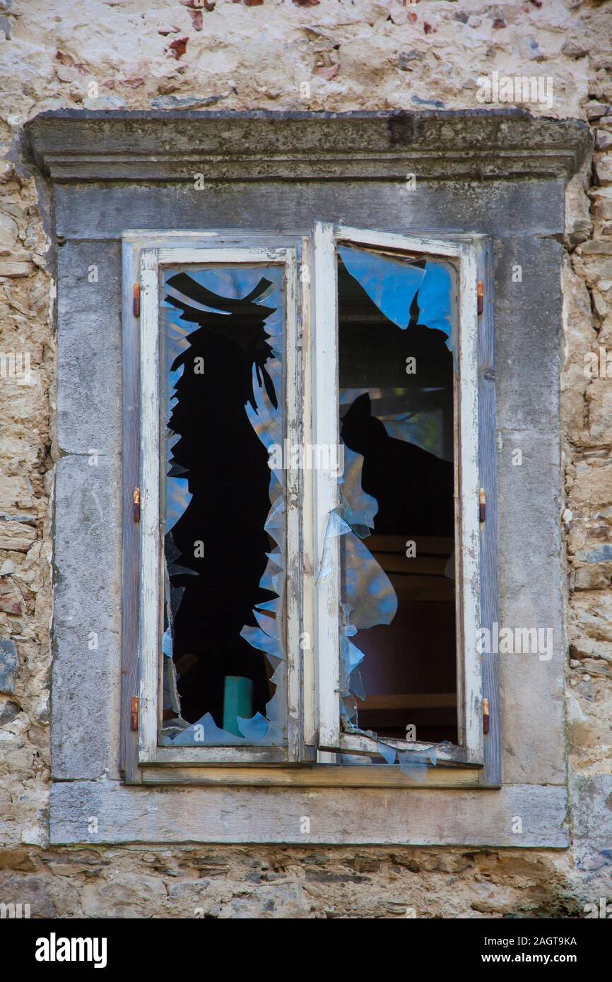 window in stone frame with broken glass with blue reflex Stock Photo ...