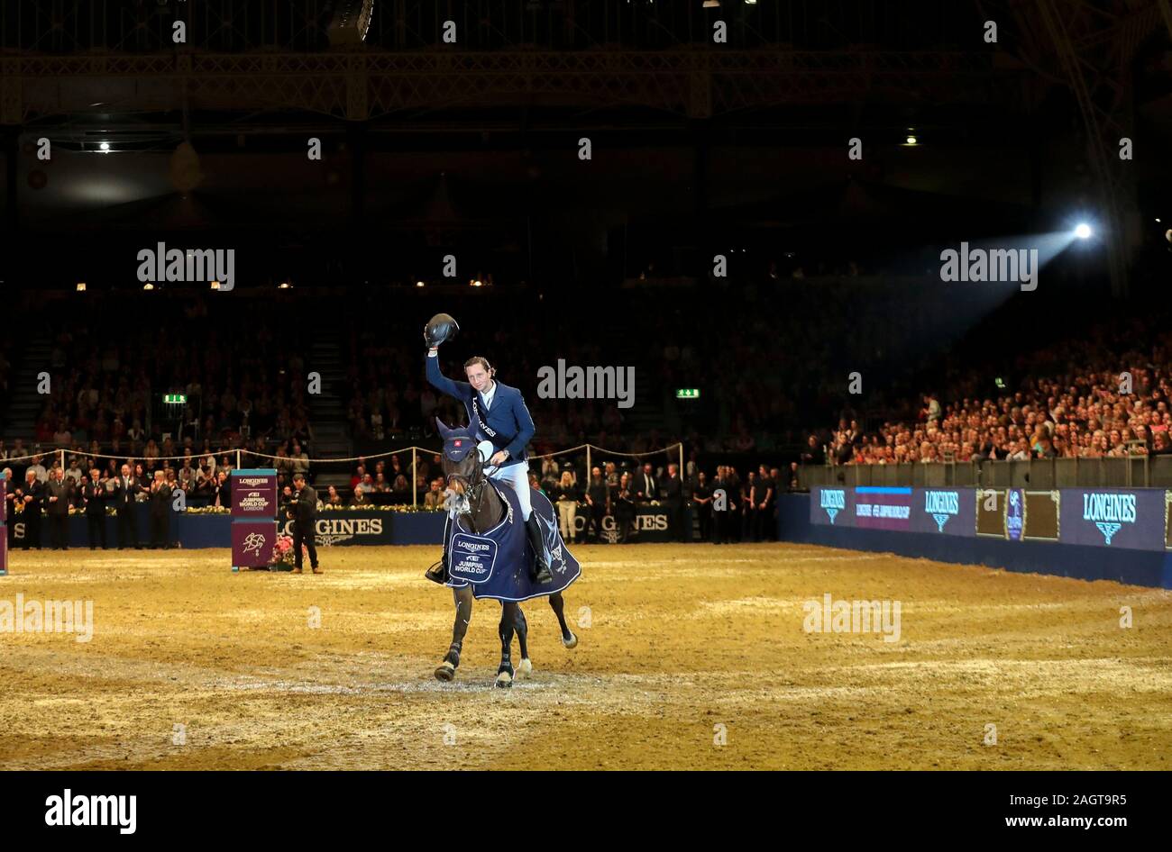 Martin Fuchs riding The Sinner wins the Longines FEI Jumping World Cup during day six of The London International Horse Show at London Olympia. Stock Photo