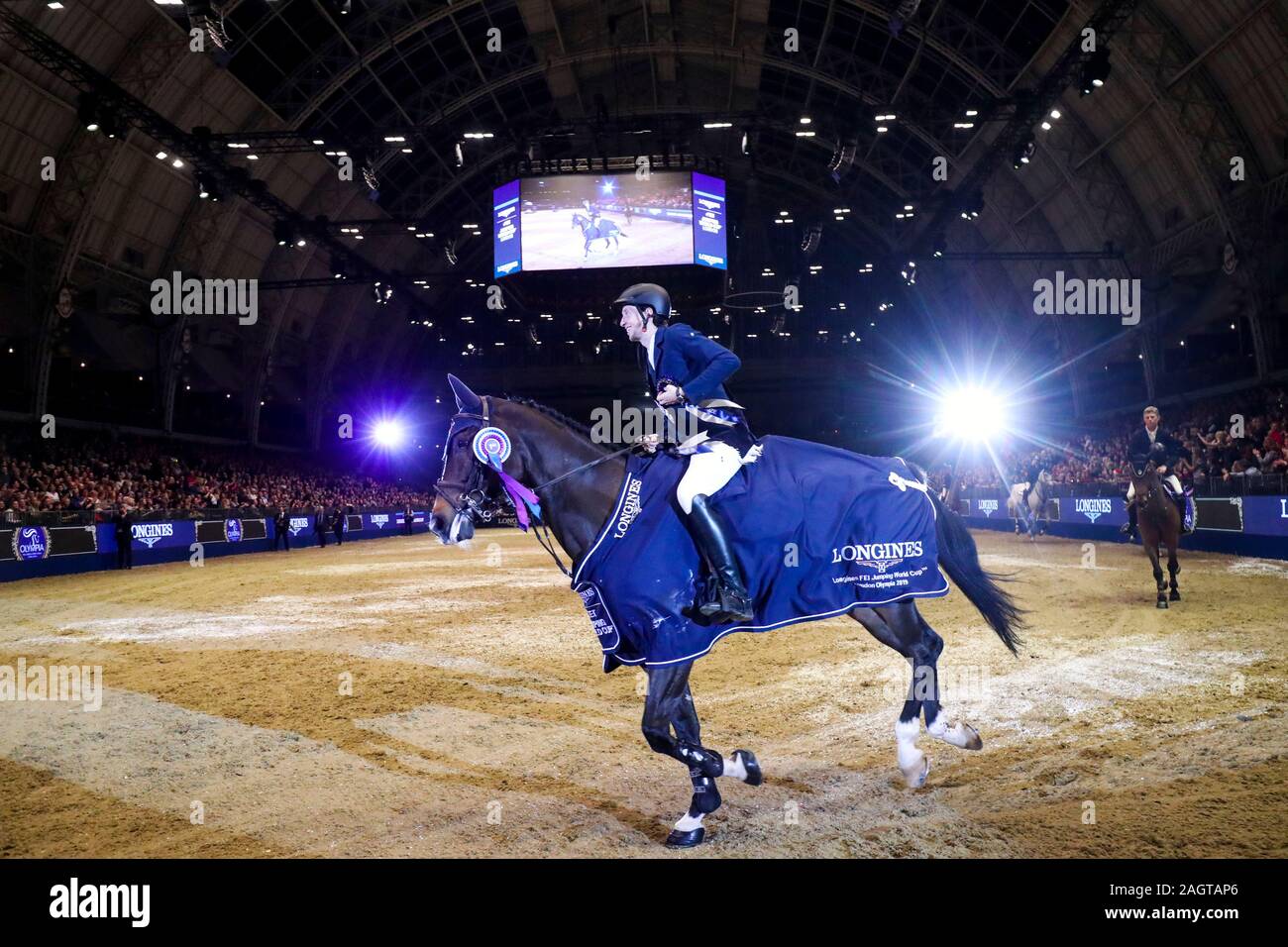 Martin Fuchs riding The Sinner wins the Longines FEI Jumping World Cup during day six of The London International Horse Show at London Olympia. Stock Photo