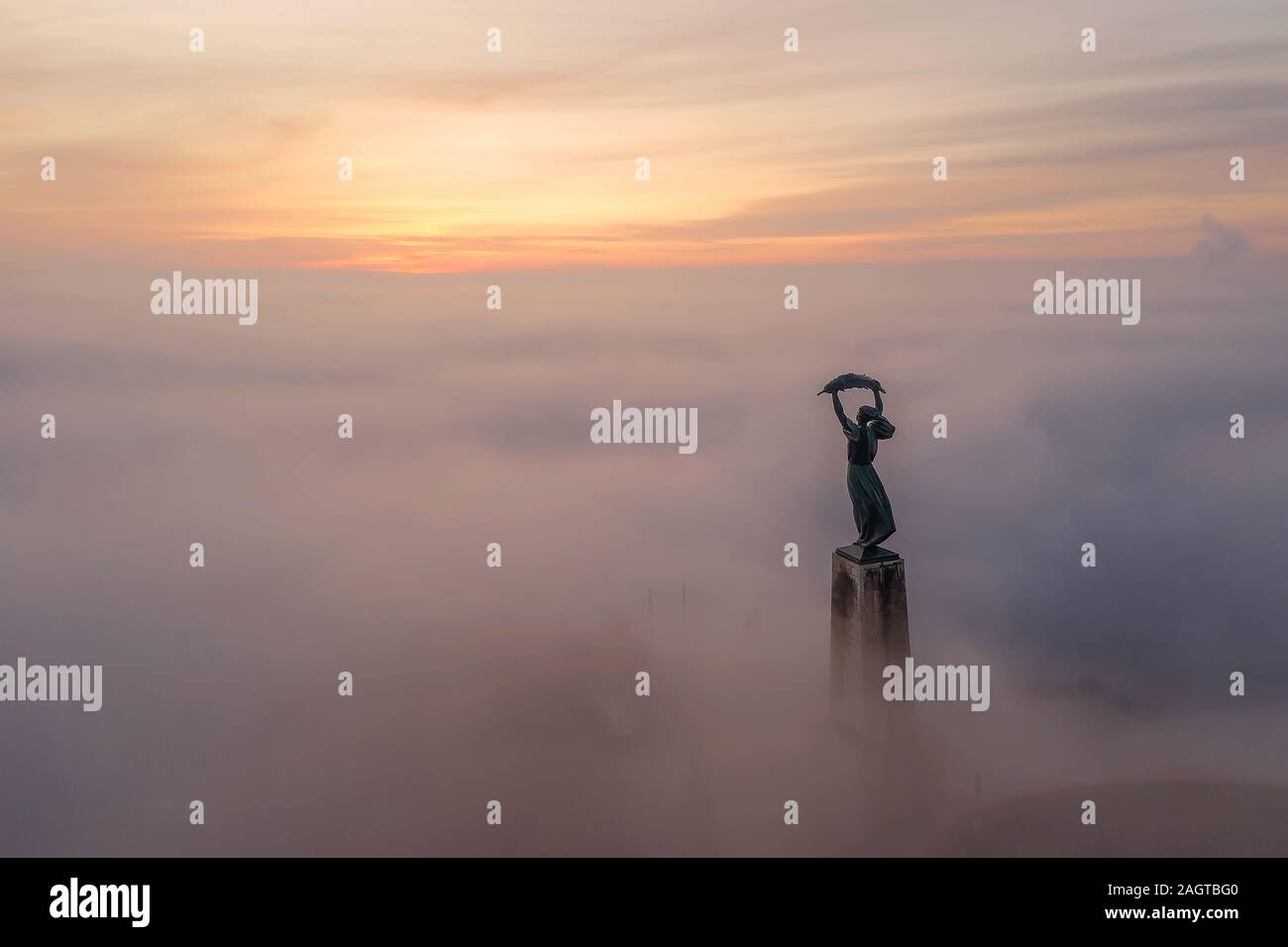 Moody foggy morning in Citadella. Budapest. Hungary. 2019 Winter. Rising sun. fog. mist. Liberty bridge. Bad weather Stock Photo