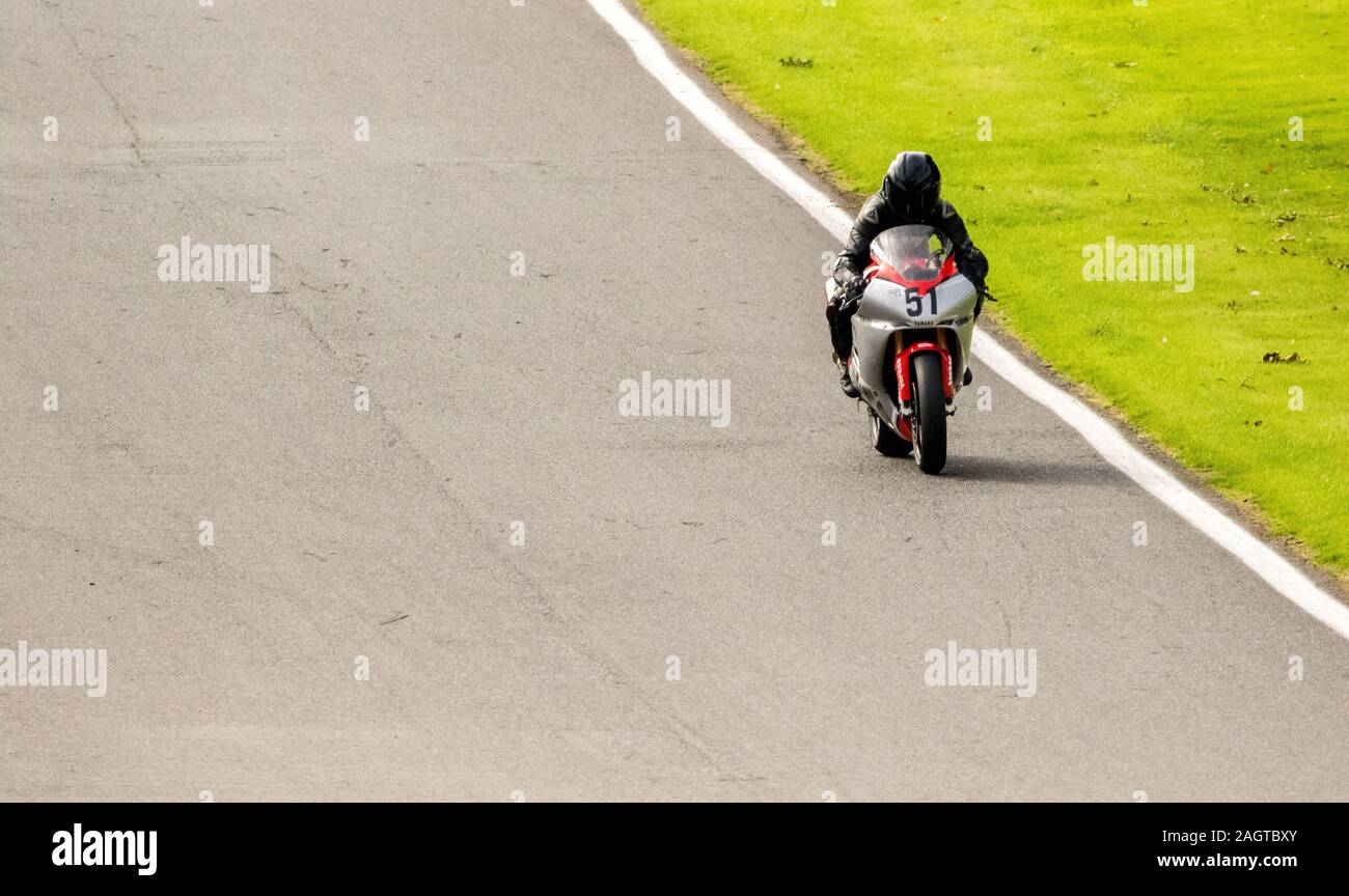 Motorbikes race around the famous track at Cadwell Park, in England, UK. Stock Photo
