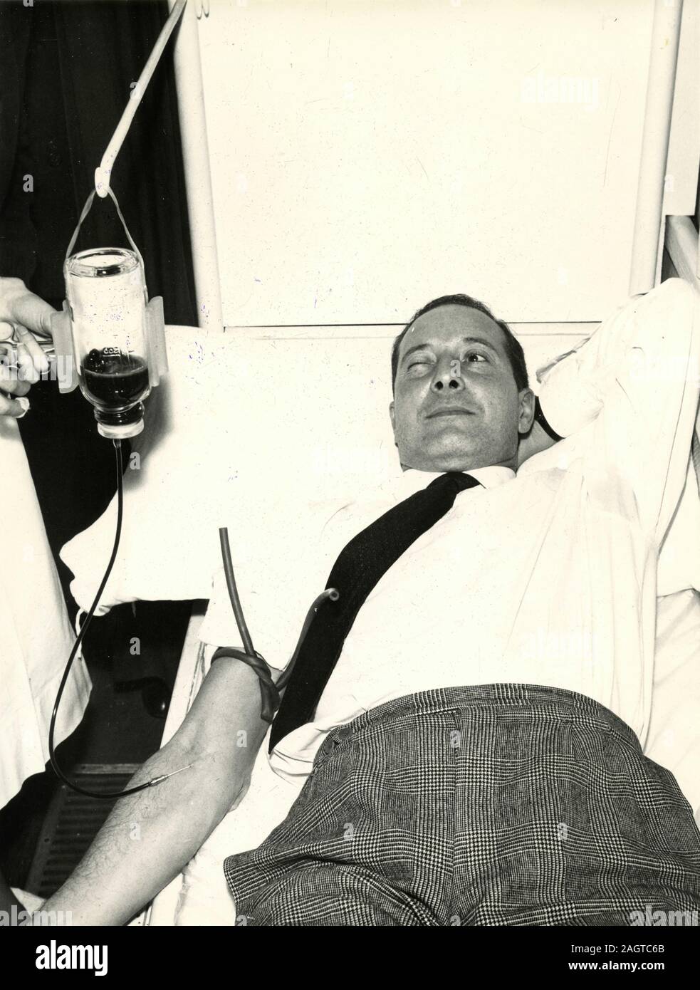 Italian politician Bruno Storti donating blood, Rome, Italy 1960s Stock Photo