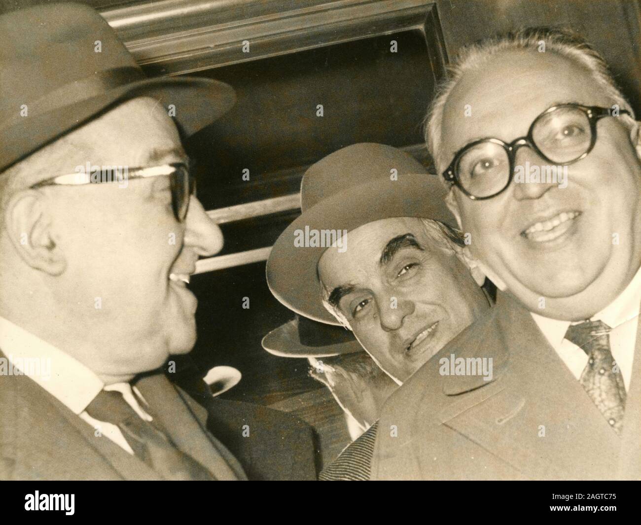 Italian politician ministers Adone Zoli, Gennaro Cassiani, and Silvio Gava coming out of the council of ministers, Rome, Italy 1957 Stock Photo