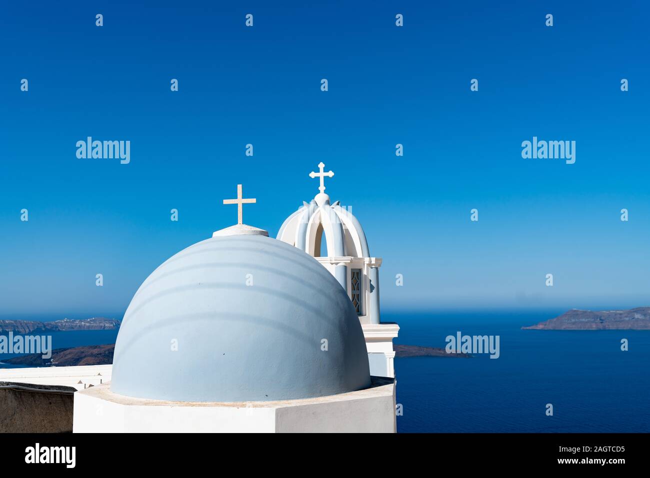 Two domes in light blue on the Greek Cyclades Island of Santorini. Stock Photo