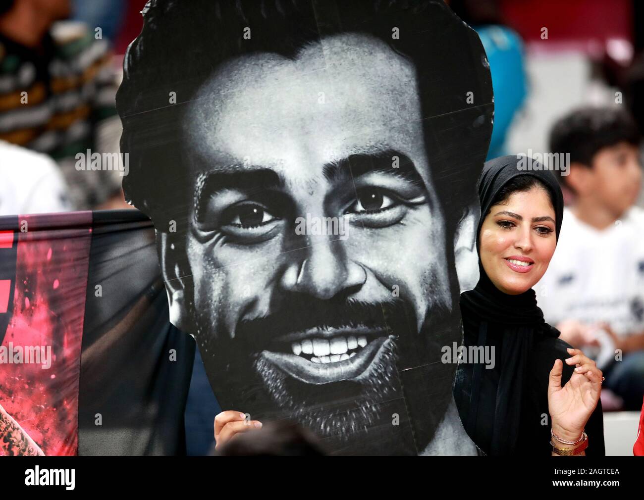A fan with a giant Mohamed Salah face in the stands during the FIFA Club World Cup final at the Khalifa International Stadium, Doha. Stock Photo