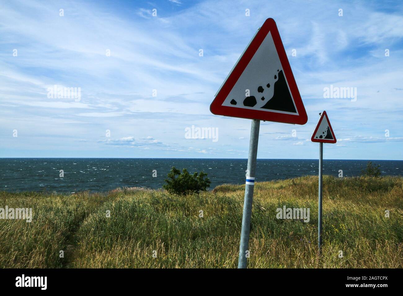 The Picture from the wild coast of Paldiski in Estonia. You can see the warning signs showing the instability of the cliffs. Stock Photo