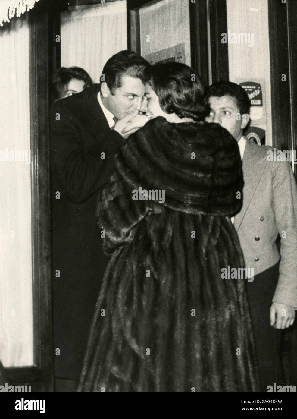 Empress Soraya Esfandiary-Bakhtiary of Iran and Prince Raimondo Orsini kissing her hand, Rome, Italy 1960s Stock Photo