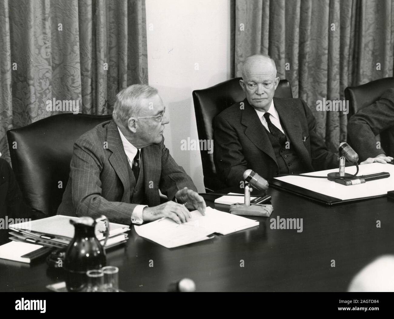 US Secretary of State John Foster Dulles and US President Dwight Eisenhower during a televised cabinet meeting, Washington, DC, USA 1954 Stock Photo