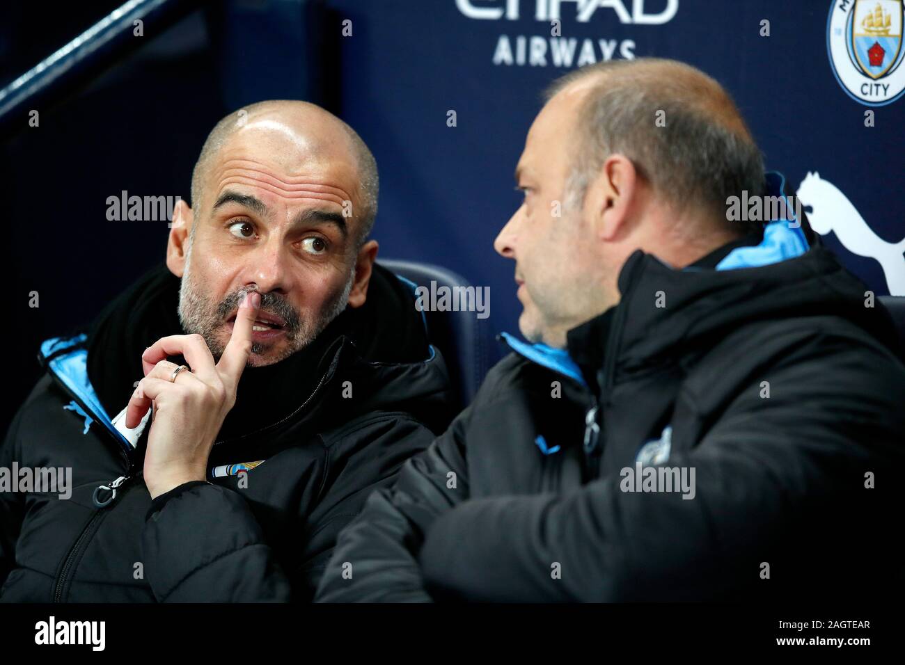 Manchester City manager Pep Guardiola (left) with assistant Rodolfo Borrell before the Premier League match at the Etihad Stadium, Manchester. Stock Photo