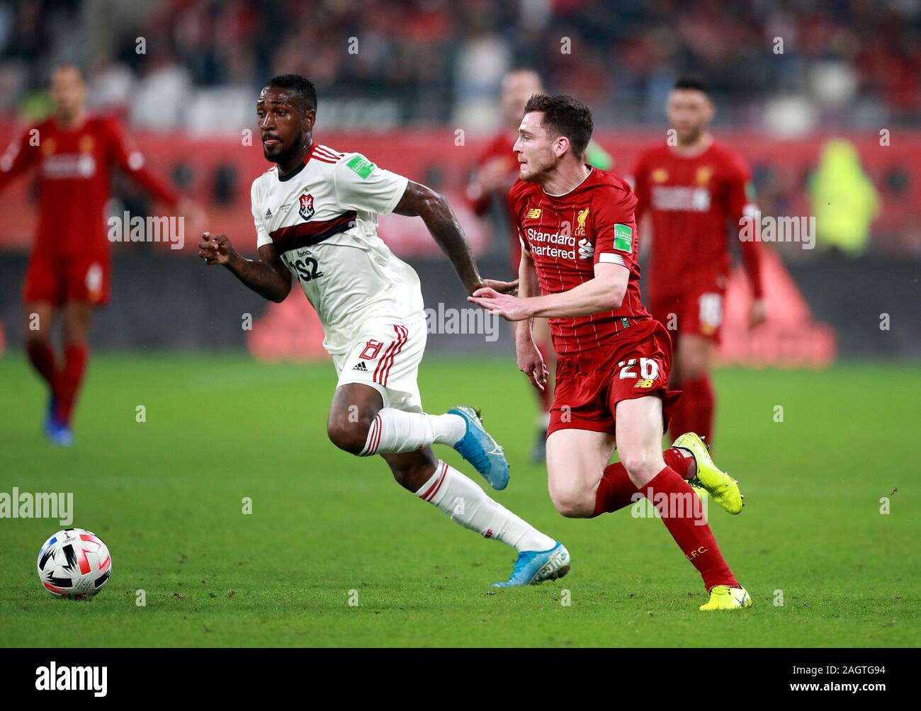 Flamengo's Gerson (left) and Liverpool's Andrew Robertson (right) battle for the ball during the FIFA Club World Cup final at the Khalifa International Stadium, Doha. Stock Photo