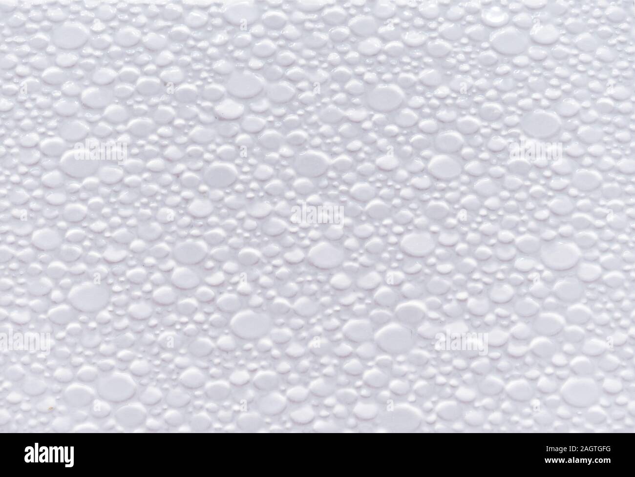Texture of white ceramic tiles with volumetric small stones. Stock Photo