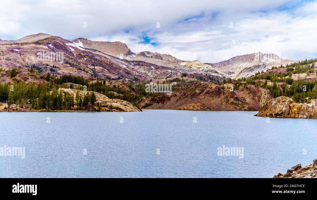 The clear glacial water of Tioga Lake at an elevation of 2938m on Tioga Pass in the eastern part of Yosemite National Park, California, United States Stock Photo