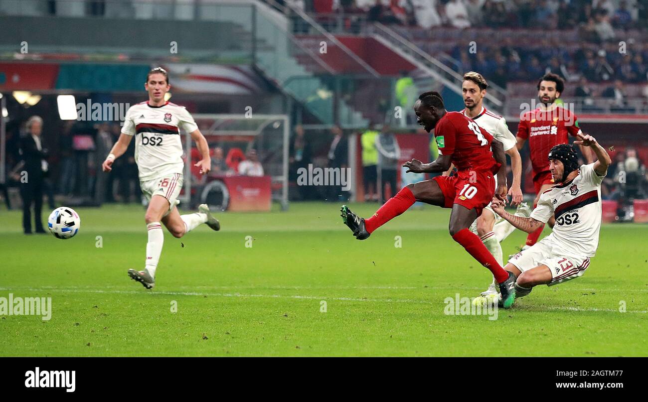 Liverpool's Sadio Mane is brought down by Flamengo's Rafinha (right) but VAR rules it to not be a foul during the FIFA Club World Cup final at the Khalifa International Stadium, Doha. Stock Photo