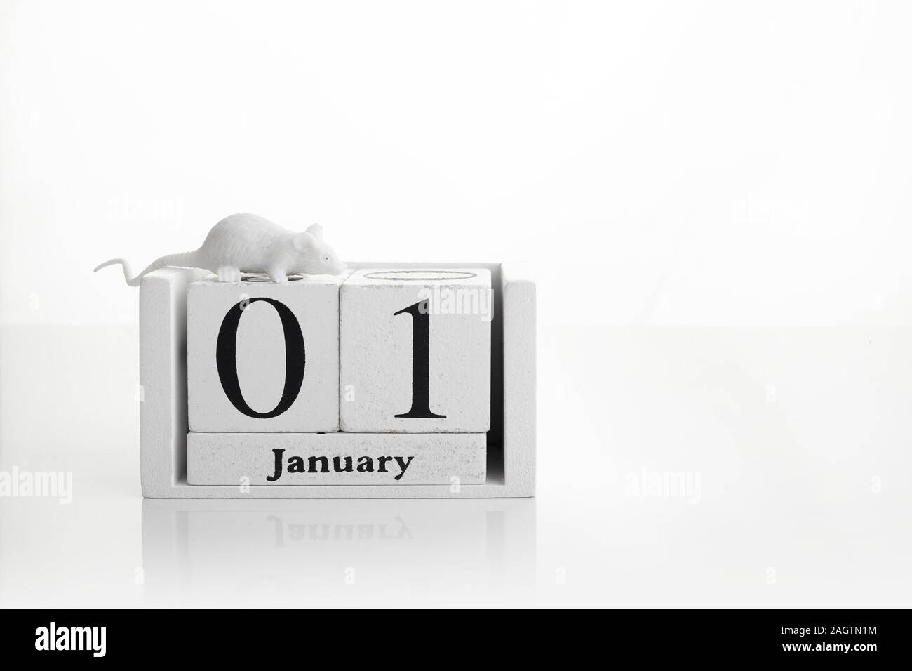 January 1st. Image of wooden calendar on white background. Empty space for text. Happy new years. Stock Photo