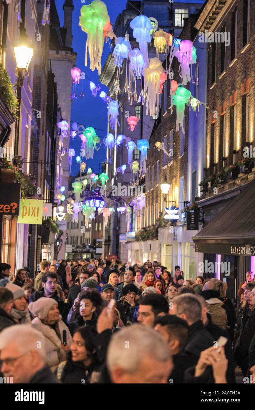 Central London, London, 21st Dec 2019. Carnaby Street and surrounding areas are crowded with shoppers. Shoppers in Oxford Street, Regent Street and Bond Street rush to make their last minute purchases in time for Christmas, whilst shops have already started heavy discounting on many goods. Stock Photo