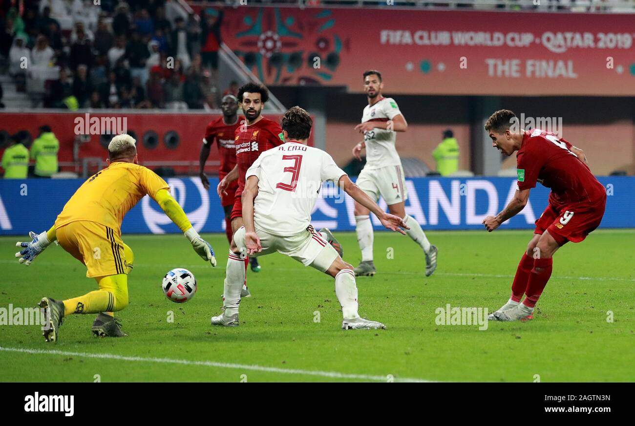 Liverpool's Roberto Firmino scores his side's first goal of the game during the FIFA Club World Cup final at the Khalifa International Stadium, Doha. Stock Photo