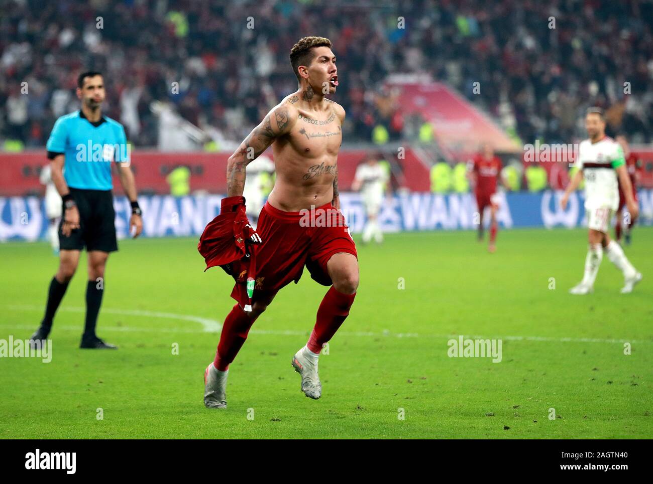 Liverpool's Roberto Firmino celebrates scoring his side's first goal of the game during the FIFA Club World Cup final at the Khalifa International Stadium, Doha. Stock Photo