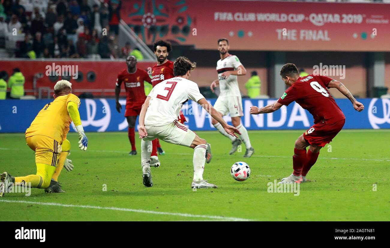 Liverpool's Roberto Firmino scores his side's first goal of the game during the FIFA Club World Cup final at the Khalifa International Stadium, Doha. Stock Photo