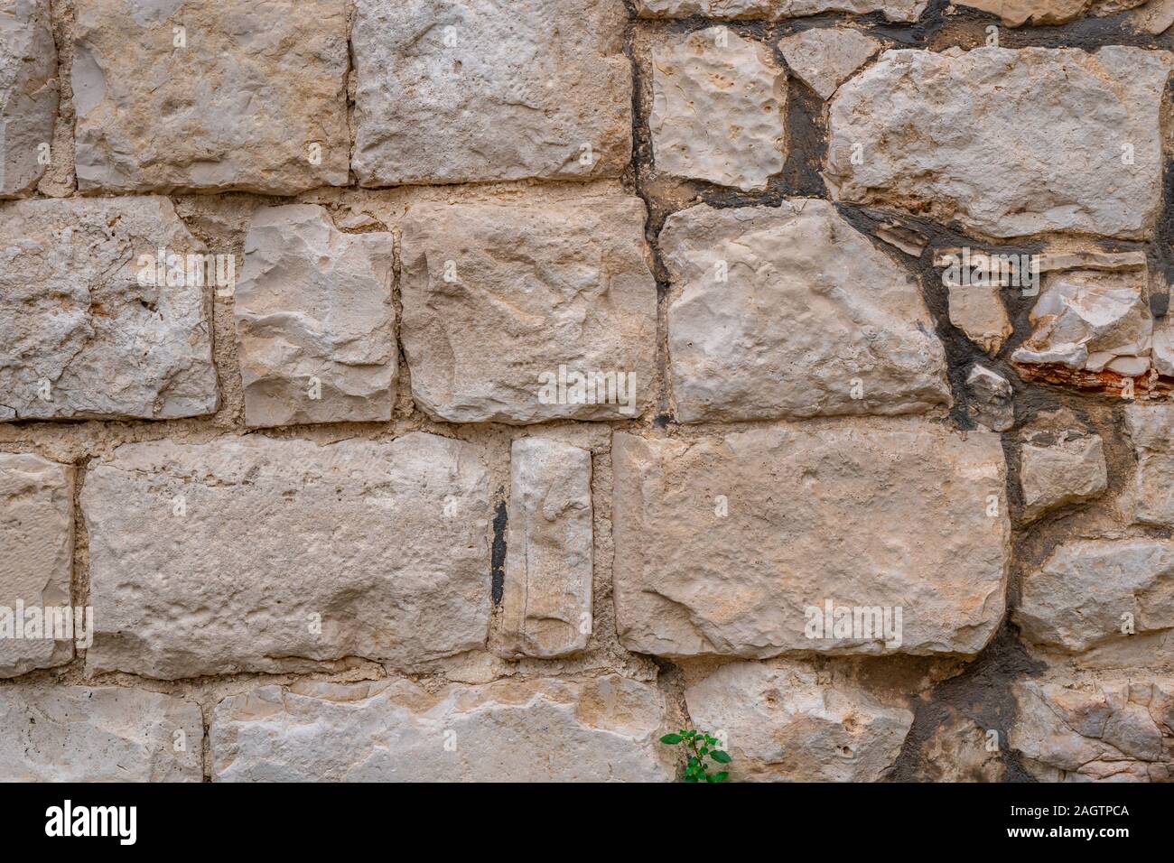 Gray old stone wall background. yellow rock wall made of stone. Texture ...