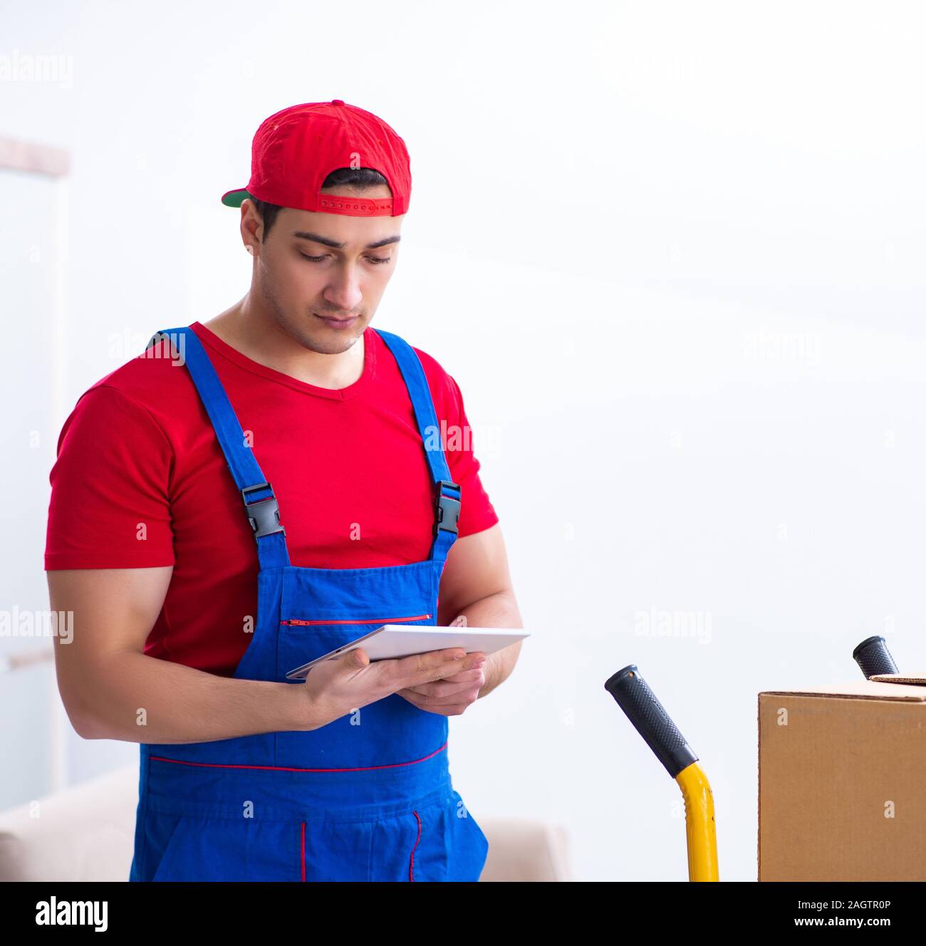 The contractor worker moving boxes during office move Stock Photo