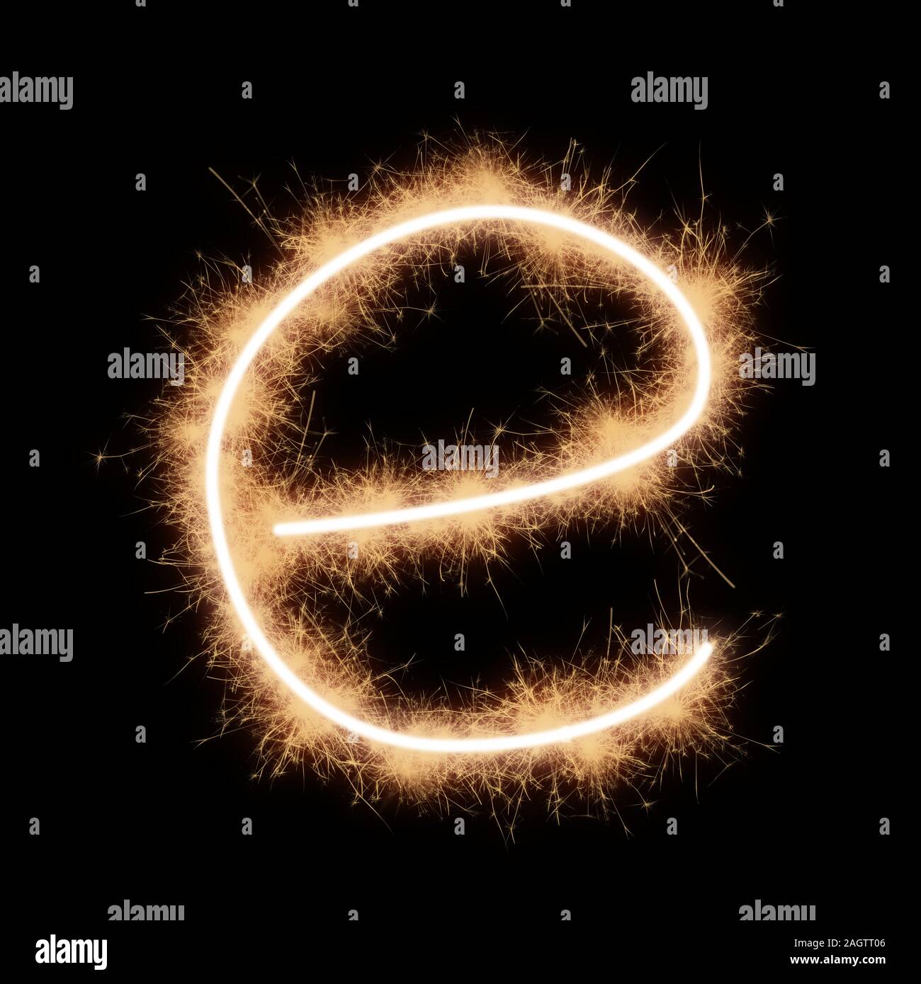 Lower case e letter of alphabet written by squib sparks on a black background. Stock Photo