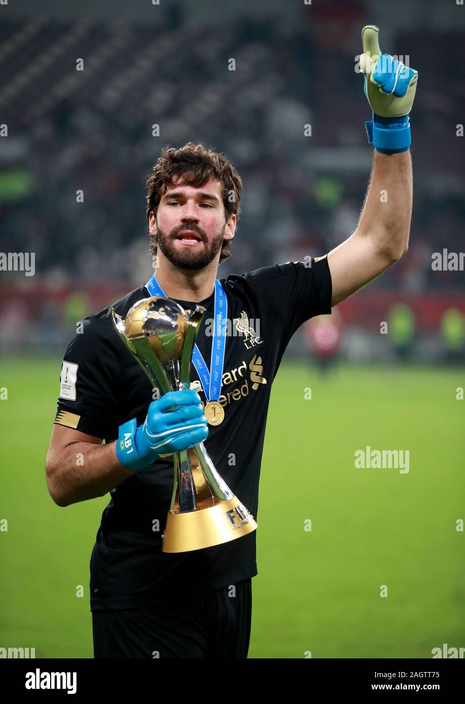Liverpool's Alisson celebrates with the trophy after the FIFA Club World Cup final at the Khalifa International Stadium, Doha. Stock Photo
