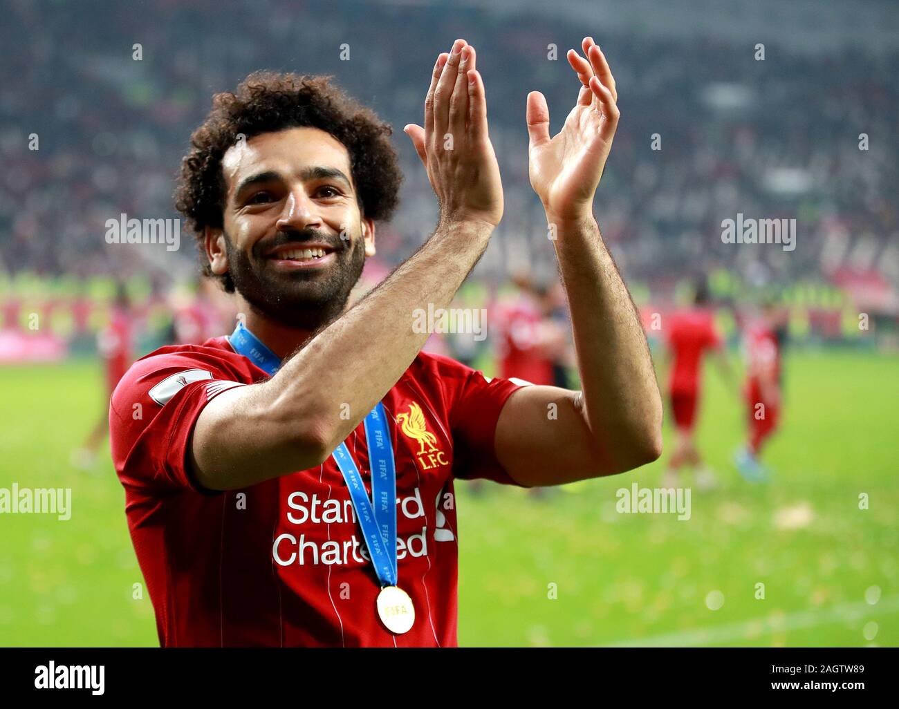 Liverpool's Mohamed Salah celebrates after the final whistle during the FIFA Club World Cup final at the Khalifa International Stadium, Doha. Stock Photo