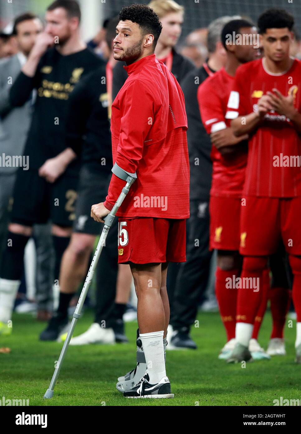 Liverpool's Alex Oxlade-Chamberlain on crutches after the FIFA Club World Cup final at the Khalifa International Stadium, Doha. Stock Photo