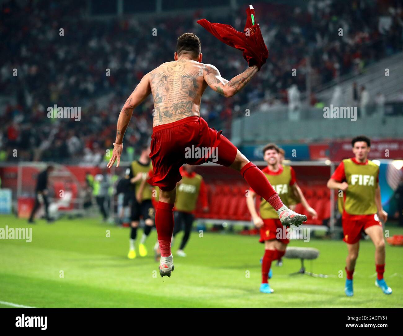 Liverpool's Roberto Firmino celebrates scoring his side's first goal of the game during the FIFA Club World Cup final at the Khalifa International Stadium, Doha. Stock Photo