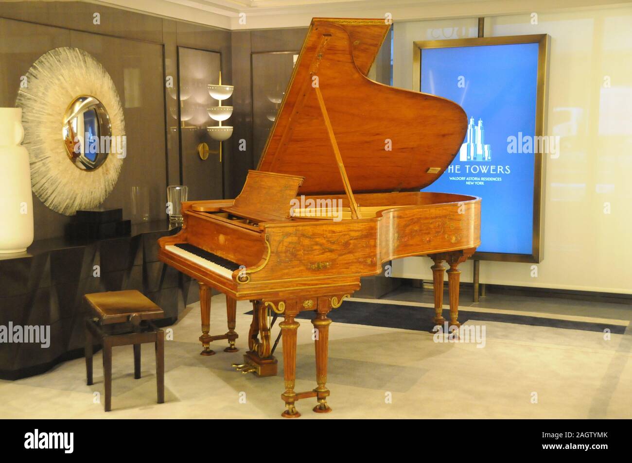 (191221) -- NEW YORK, Dec. 21, 2019 (Xinhua) -- The Cole Porter Piano is displayed after restoration in a showroom of Waldorf Astoria in New York, the United States, Dec. 19, 2019. The historic luxury hotel Waldorf Astoria New York (WANY) is making huge efforts in preserving its landmarks and artifacts while planning to start the sales of condominium residences in February 2020 and put the hotel back to business in early 2022, according to its management team, sales agent and experts. TO GO WITH 'Feature: New York's iconic Waldorf Astoria to offer residents ownership for 1st time' (Xinhua/Liu Stock Photo