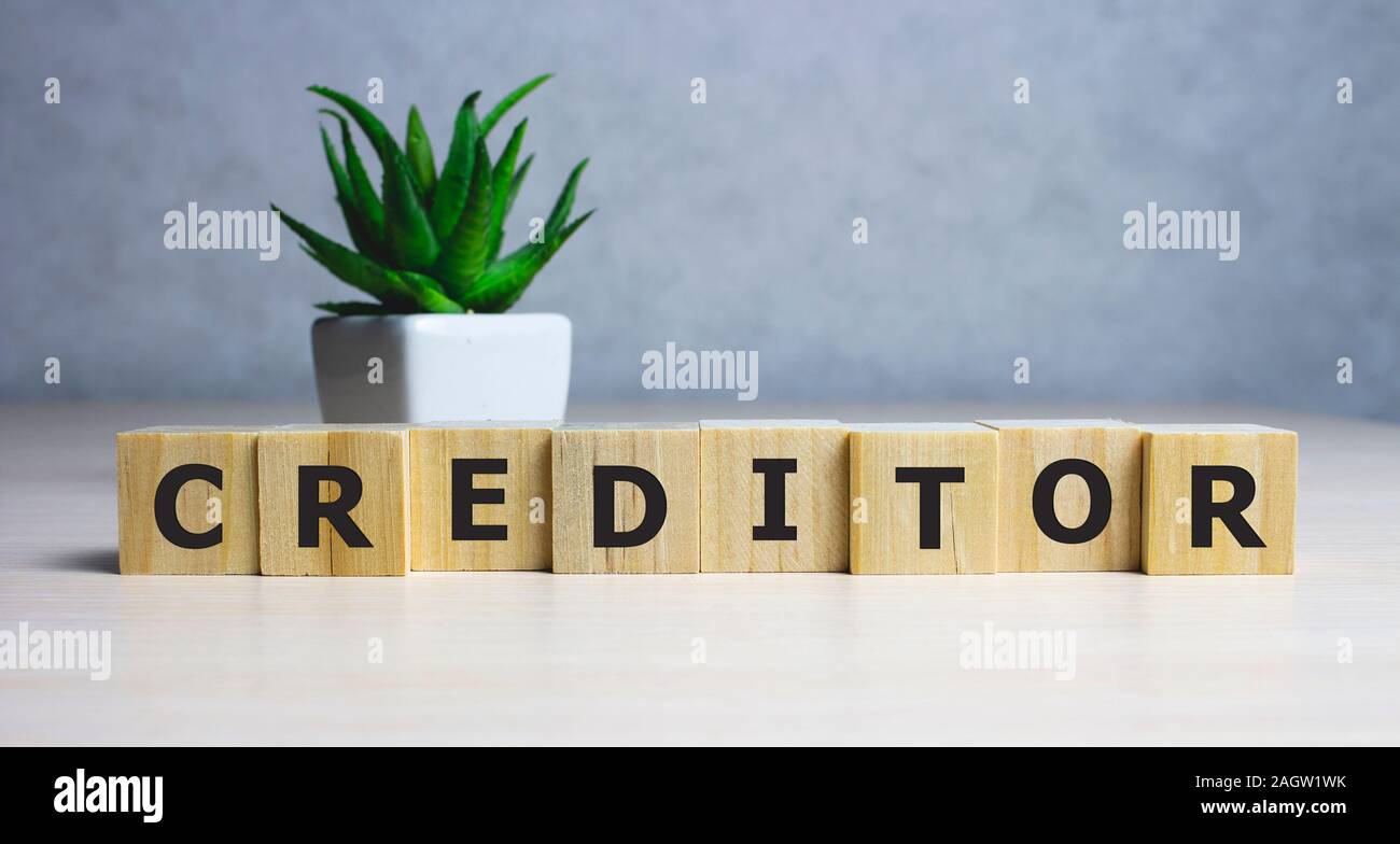 CREDITOR business word made with building blocks Stock Photo