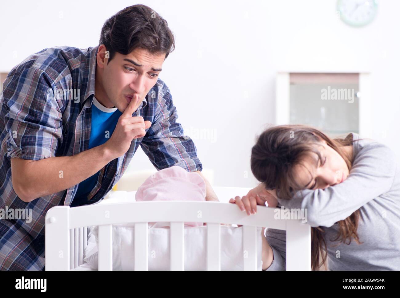 The young dad cannot stand baby crying Stock Photo - Alamy