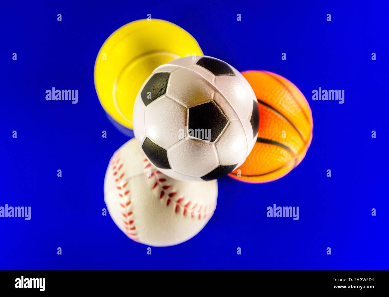 A Closeup Image Of A Stack Of Sports Balls Against A Reflective Blue Background In The Stack Is A Football Baseball Basketball And Tennis Ball Stock Photo Alamy A Closeup Image Of A Stack Of Sports Balls Against A Reflective Blue Background In The Stack Is A Football Baseball Basketball And Tennis Ball Stock Photo Alamy