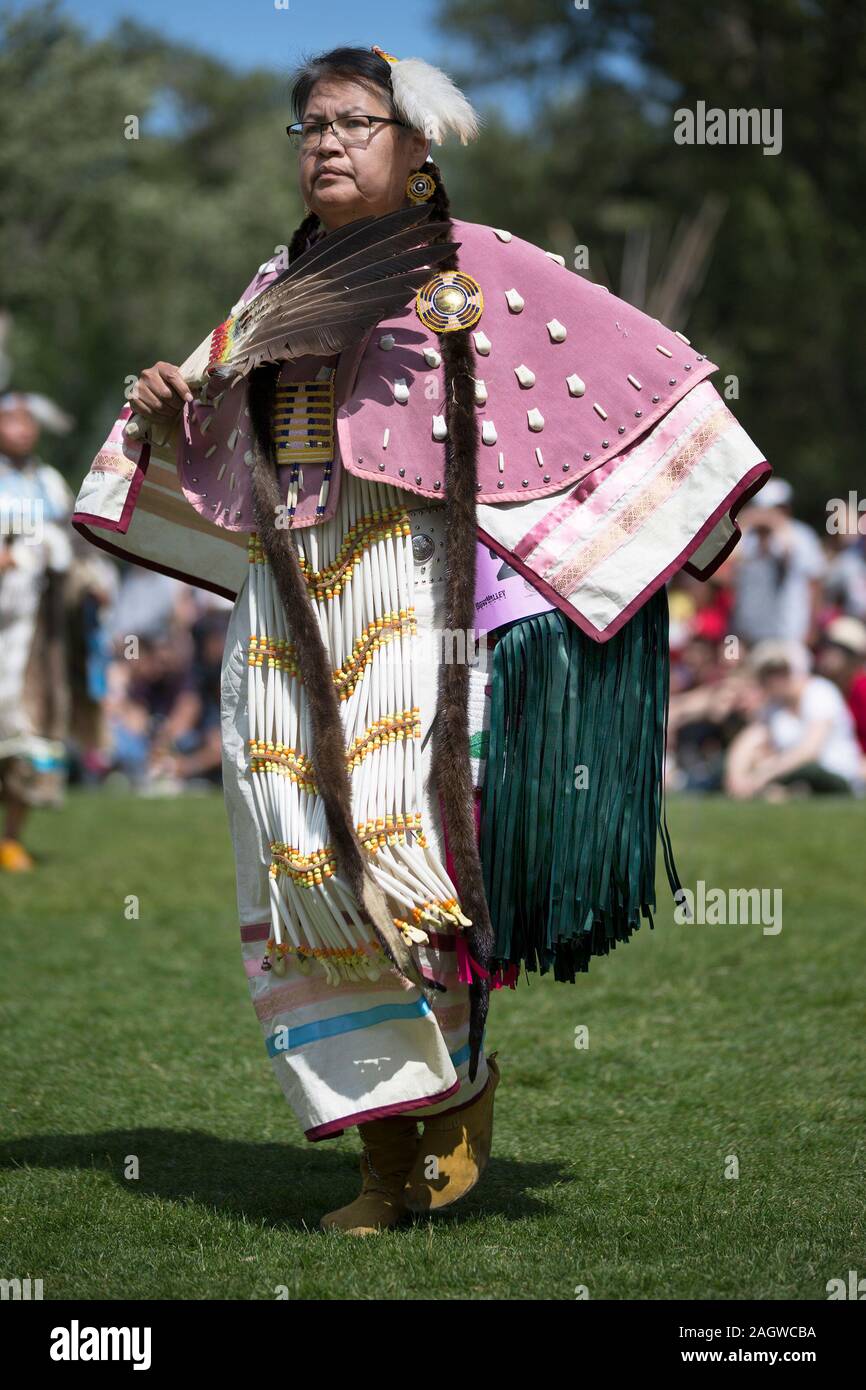 Indigenous woman dancing in Canada Day powwow. Stock Photo