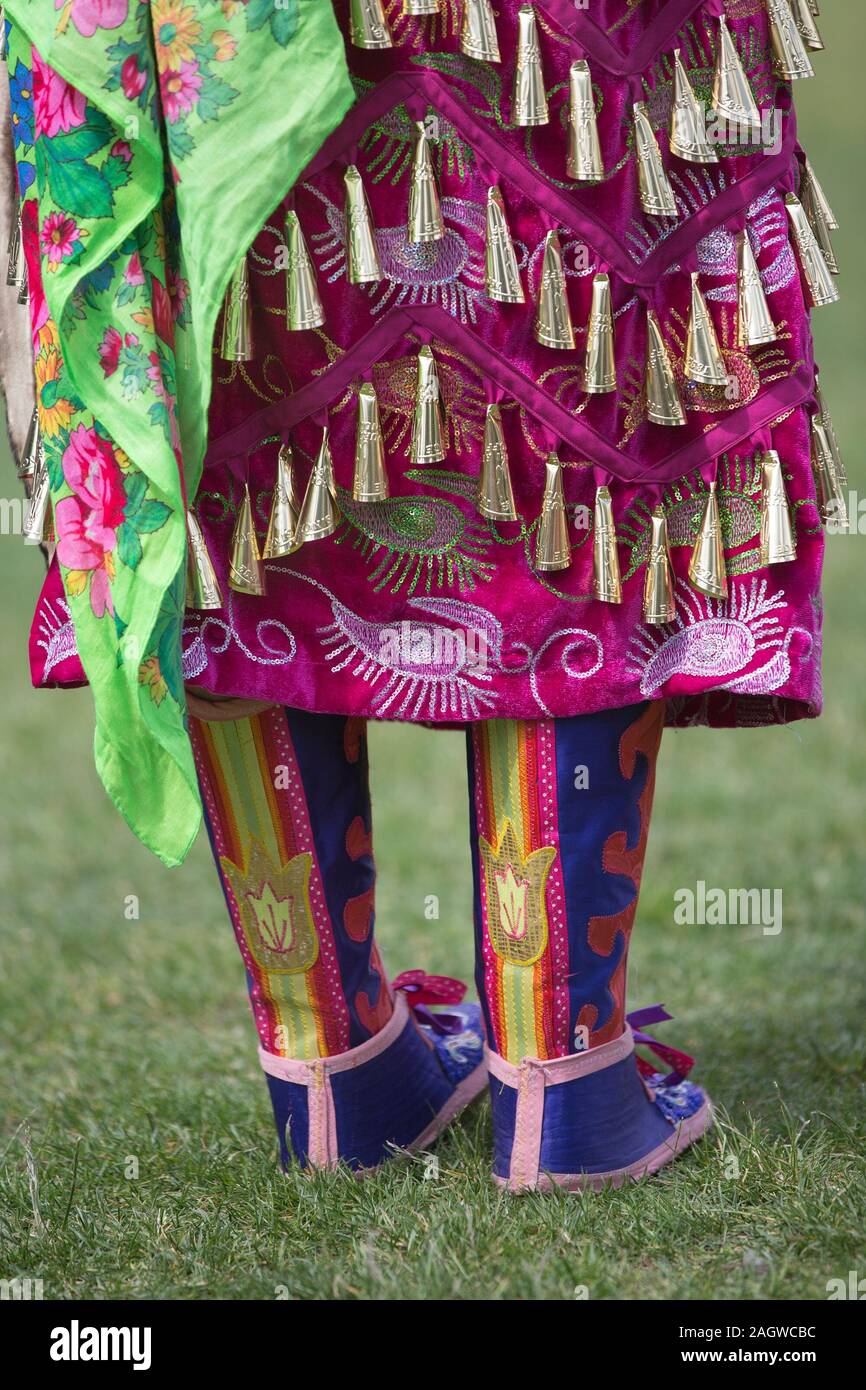 Detail of jingle dance costume worn by indigenous woman in Canada Day powwow. Stock Photo