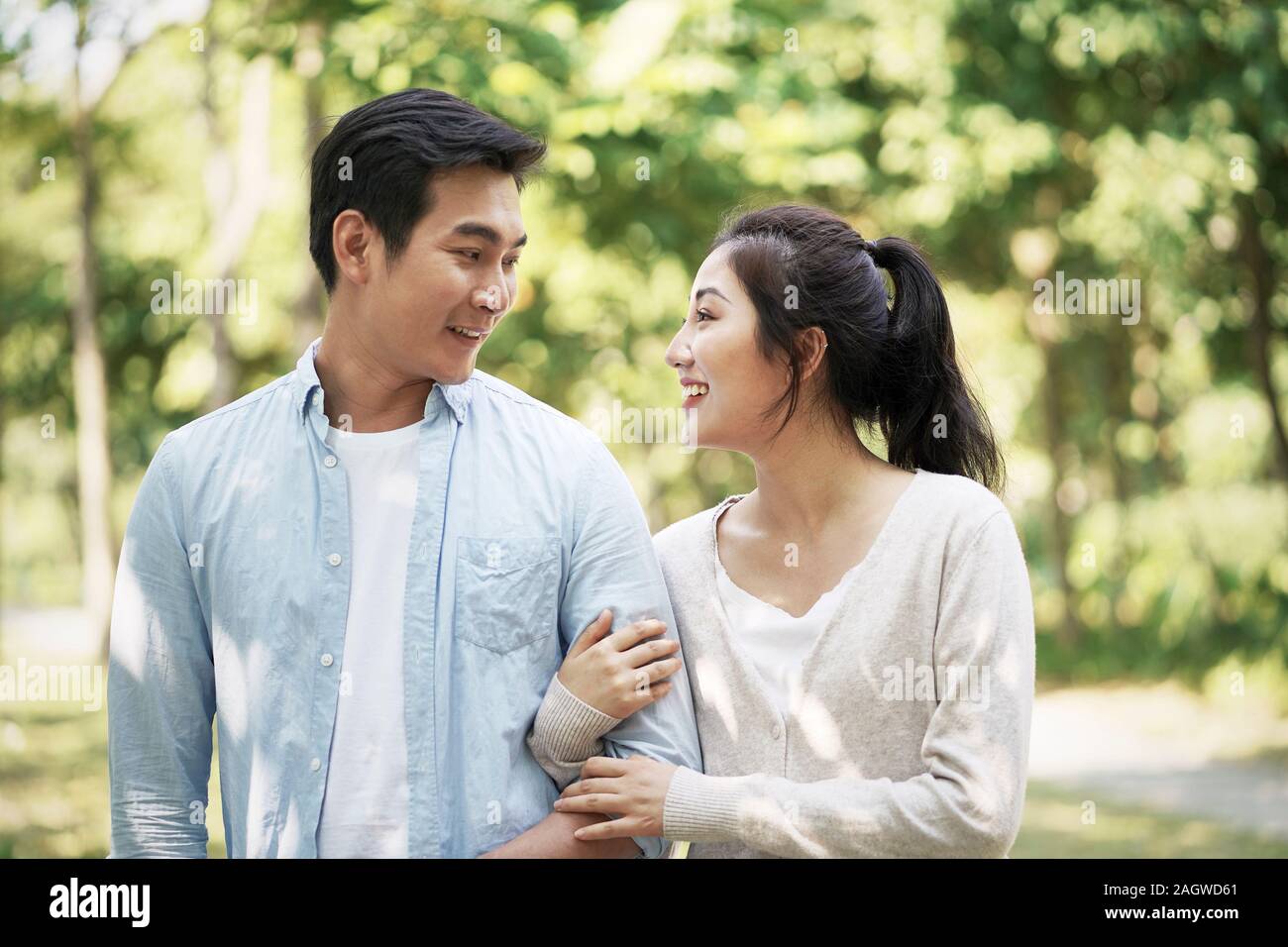 Happy young chinese couple in the park hi-res stock photography and ...