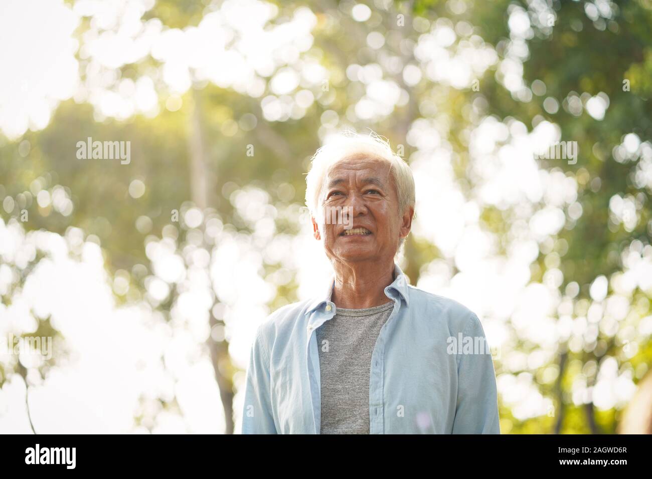 outdoor portrait of chinese old man, happy and smiling Stock Photo