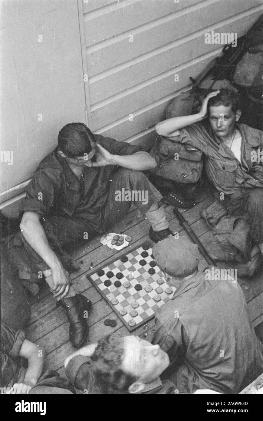 Sailors working on the drafts game; Date 16 June 1947 Location Batavia, Indonesia, Jakarta, Dutch East Indies, Tandjong Priok Stock Photo