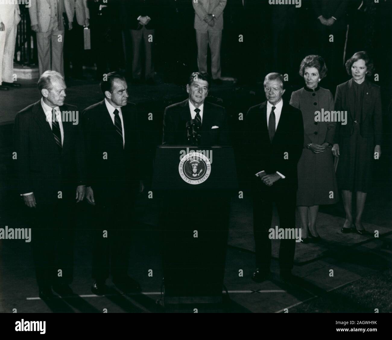 Oct 8, 1981 - Washington, District of Columbia, U.S. - President RONALD W. REAGAN (at podium) as he addressed the nation to eulogize the late President Sadat of Egypt. Sadat was assassinated October 6th in Cairo while reviewing a parade. Shown left to right are: Former president GERALD R. FORD; Former president RICHARD M. NIXON; (president Reagan); former president JIMMY CARTER, First Lady NANCY REAGAN and former first lady, ROSALYNN CARTER. The four men will be part of the U.S. Delegation attending the funeral for the slain leader. (Credit Image: © Keystone Press Agency/Keystone USA via ZUMAP Stock Photo