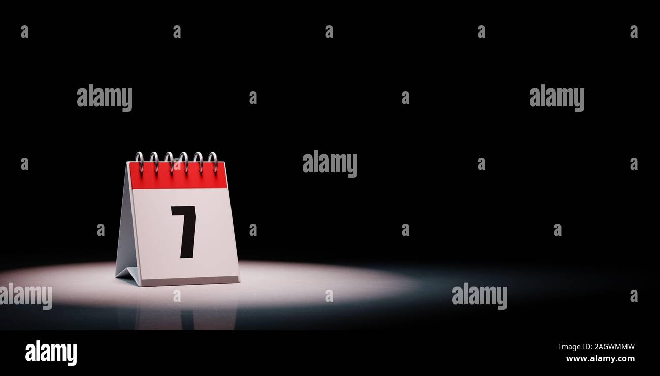 Red and White Single Day Desk Calendar Spotlighted on Black Background with Copy Space 3D Illustration, Day 7 of the Month Stock Photo