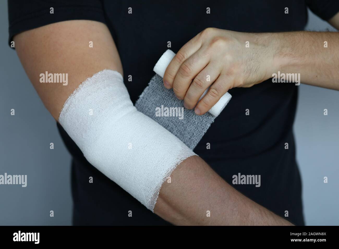 Male hand with tight elastic bandage on elbow closeup Stock Photo Alamy